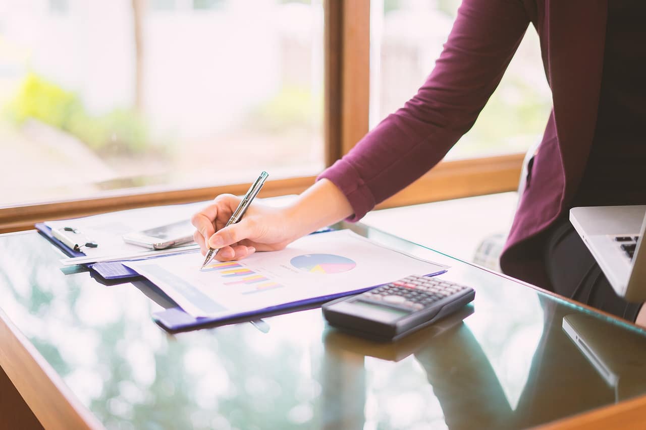 Documents with charts and graphs on a desk